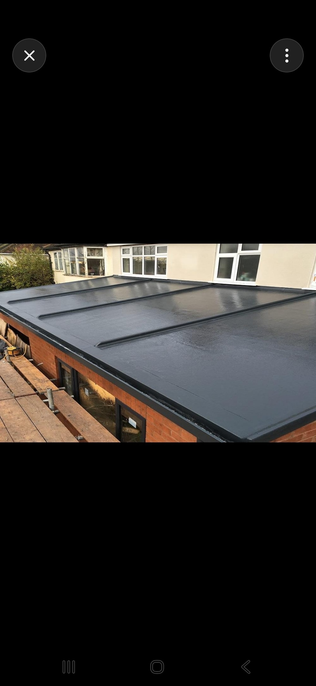 Aerial view of a completed GRP fibreglass flat roof on a residential garage
